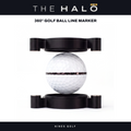 The Halo 360° golf ball line marker by Nines Golf, shown open with a white golf ball between its two black magnetic halves